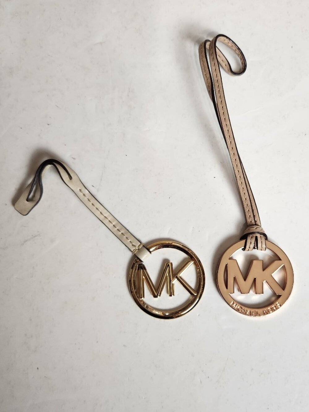 2 Michael Kors MK Logo Bag Charms Rose Gold Tone Medallion Grayish Leather Strap